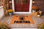 I'd Rather Be Painting doormat for artists, a natural coir welcome mat with black paint brush and tube graphics, displayed on a fall porch with pumpkins and mums, perfect for a creative home entrance or a unique housewarming