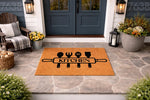 Kitchen doormat with a rolling pin and cooking utensils design, featuring a natural coir fiber texture on a stone porch, this decorative welcome mat is a functional home decor piece for any front door entrance or kitchen entryway.
