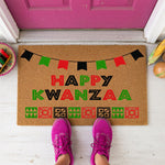 a door mat that says happy kwanzaa on it