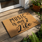 Music is my life doormat featuring black text and musical note icons on a natural coir fiber welcome mat, perfect for a musician home entrance, front porch decor, or a unique housewarming entry rug for music lovers and band