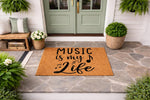 Music is my life doormat featuring black musical notes on a natural coir fiber welcome mat, displayed on a stone porch entryway for a musician home decor look that adds a stylish touch to any front door entrance or outdoor patio