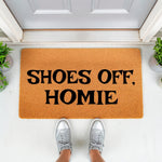 Funny Shoes Off Homie coir doormat for front porch entry, featuring bold black text on a natural fiber rug.