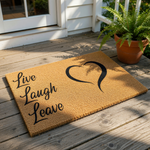 Live Laugh Leave doormat with a black heart design on a natural coir fiber welcome mat, featuring funny front porch decor for a home entrance that serves as a humorous housewarming gift for friends or family members.