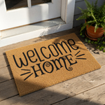 Welcome Home coir doormat featuring black script text on a natural fiber rug, this durable outdoor welcome mat is a stylish front porch decor piece for housewarming entryways and adds a cozy look to any home entrance or front