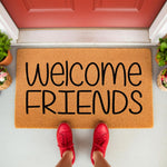 Welcome Friends coir doormat for front porch entry, featuring natural fiber material with bold black text.