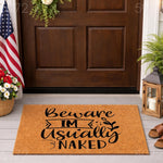 Funny Beware I'm Usually Naked doormat for front porch decor, featuring bold black text on a natural coir fiber welcome mat, perfect for a humorous home entrance, housewarming, or a cheeky outdoor entryway floor rug design.