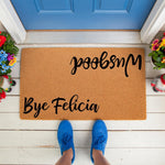 Funny doormat with Bye Felicia and Wusgood text, a natural coir fiber welcome mat for front porch decor.