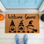 Halloween gnome doormat featuring three cute gnomes with a pumpkin and broom, this natural coir welcome mat is a festive fall porch decor piece that adds seasonal charm to your front door entrance for autumn and spooky holiday
