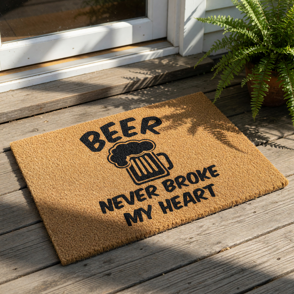 Beer never broke my heart doormat featuring a funny quote and a beer mug graphic on a natural coir fiber welcome mat, perfect for a front porch, man cave, or home bar decor for any beer lover looking for a humorous outdoor floor