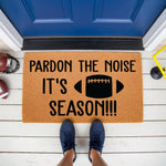 Football season doormat featuring a fun sports quote on a natural coir welcome mat, perfect for a front porch entrance during game day, with a football graphic and bold text that reads Pardon the Noise It is Football Season.