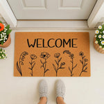 Floral Welcome Doormat featuring a natural coir texture with black line art wildflowers, perfect for a front porch entryway decor, this durable outdoor welcome mat adds a stylish touch to any home entrance for guests and visitors.