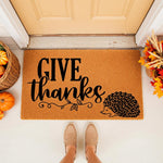 Give Thanks hedgehog doormat for fall porch decor, featuring a natural coir welcome mat with black text and a cute hedgehog illustration, perfect for autumn home entryways and seasonal outdoor floor mat decorations.
