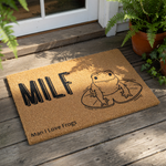 Funny frog doormat featuring a cute line art frog on a lily pad with the text MILF Man I Love Frogs, this natural coir welcome mat is a humorous outdoor floor rug for animal lovers and makes a quirky home decor piece for your