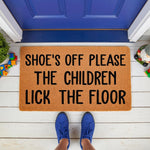 Funny Shoes Off Please The Children Lick The Floor doormat, a natural coir fiber welcome mat for front porch entryways, featuring bold black text on a durable brown mat that adds humorous home decor to any house entrance or