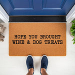 Funny Wine and Dog Treats Doormat featuring a natural coir fiber texture, perfect for a front porch entryway, this humorous welcome mat greets guests with a playful message about bringing wine and dog treats for the pet owner.