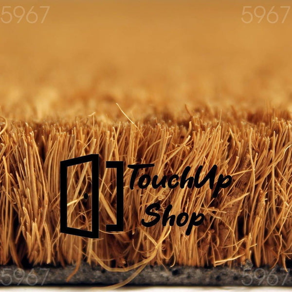 A close-up view of a textured surface, possibly a woven material or a natural plant fiber, with a warm, golden-brown color.