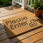 Please Enter coir doormat with a natural fiber texture and black text featuring an enter key symbol, perfect as a funny front door welcome mat, porch decor, or a unique housewarming entry rug for your home or apartment entryway.