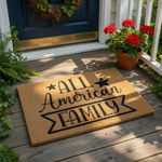 All American Family coir doormat with black text and star accents, featuring a durable natural fiber welcome mat design for front porch decor that adds a patriotic touch to your home entrance and outdoor entryway floor covering.