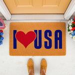 Patriotic USA doormat with a red heart design on a natural coir fiber welcome mat, perfect for a front porch entry.