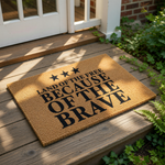 Patriotic coir doormat featuring three black stars and the text Land of the Free Because of the Brave, this durable outdoor welcome mat is a stylish front porch decor piece for any home entry or housewarming celebration.
