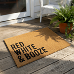 Red White and Booze coir doormat featuring bold black text on a natural fiber welcome mat, perfect for a funny front porch decor piece or a patriotic outdoor entrance rug for your home or apartment entryway.
