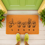 Funny Leave doormat with American Sign Language hand signs for each letter, featuring a durable coir welcome mat design on a front porch, perfect for a humorous home entrance decor or a unique housewarming gift for sign language