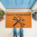 Dad's Workshop doormat featuring a hammer and wrench design on natural coir fiber, perfect for a garage or man cave entrance, this durable outdoor welcome mat adds a personalized touch to any home workshop or tool shed entryway.