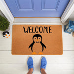 Penguin welcome doormat featuring a cute black and white bird illustration on natural coir fiber, perfect for a front porch entry rug or outdoor floor mat decor that adds a fun animal theme to your home entrance and doorstep.