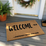 Funny Welcome-ish Doormat made of natural coir fiber, featuring bold black text that reads Welcome-ish and ...depends who you are, creating a humorous and sarcastic entryway decor piece for your front porch or home entrance.