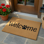 Paw Print Welcome Doormat made of natural coir fiber, featuring the word Welcome printed in black ink with a cute paw print replacing the letter o, set against a clean white background for a simple and inviting front porch