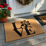 Love paw print coir doormat featuring a bold black design on a natural brown fiber background, where the letter O is replaced by a cute dog paw print with a heart shape inside the main pad for a charming pet lover home entryway