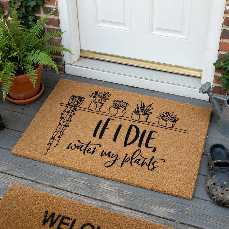 Funny Plant Lover Doormat featuring a line art illustration of potted succulents on a shelf and the text If I Die, Water My Plants, printed in black ink on a natural brown coir fiber mat against a clean white studio background.