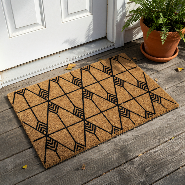 Modern Geometric Coir Doormat featuring a bold black chevron and diamond pattern printed on a natural tan fiber background, creating a stylish and durable entryway floor mat for your home decor against a clean white studio