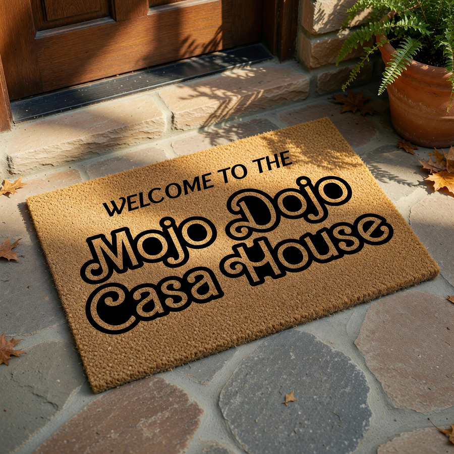 Mojo Dojo Casa House welcome doormat featuring bold, retro-style black typography printed on a natural tan coir fiber mat, creating a fun and trendy entryway accent for any home that loves pop culture references and unique decor.