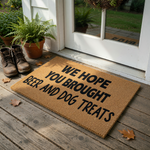 Funny Dog Lover Doormat featuring a natural coir texture with bold black text that reads We Hope You Brought Beer And Dog Treats, making it a humorous and welcoming front porch accessory for any pet owner home entrance.