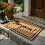 Bonjour! welcome doormat made of natural coir fiber with a black rectangular border and elegant script lettering, providing a stylish and functional entryway floor covering for your home front porch or apartment door entrance.