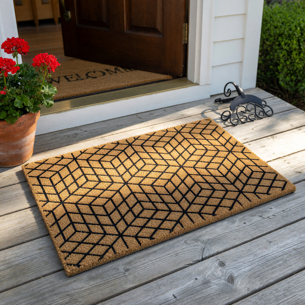 Geometric pattern coir doormat featuring a modern black cube design printed on a natural tan fiber background, creating a stylish and durable entryway floor mat that adds a contemporary touch to any home front porch or indoor