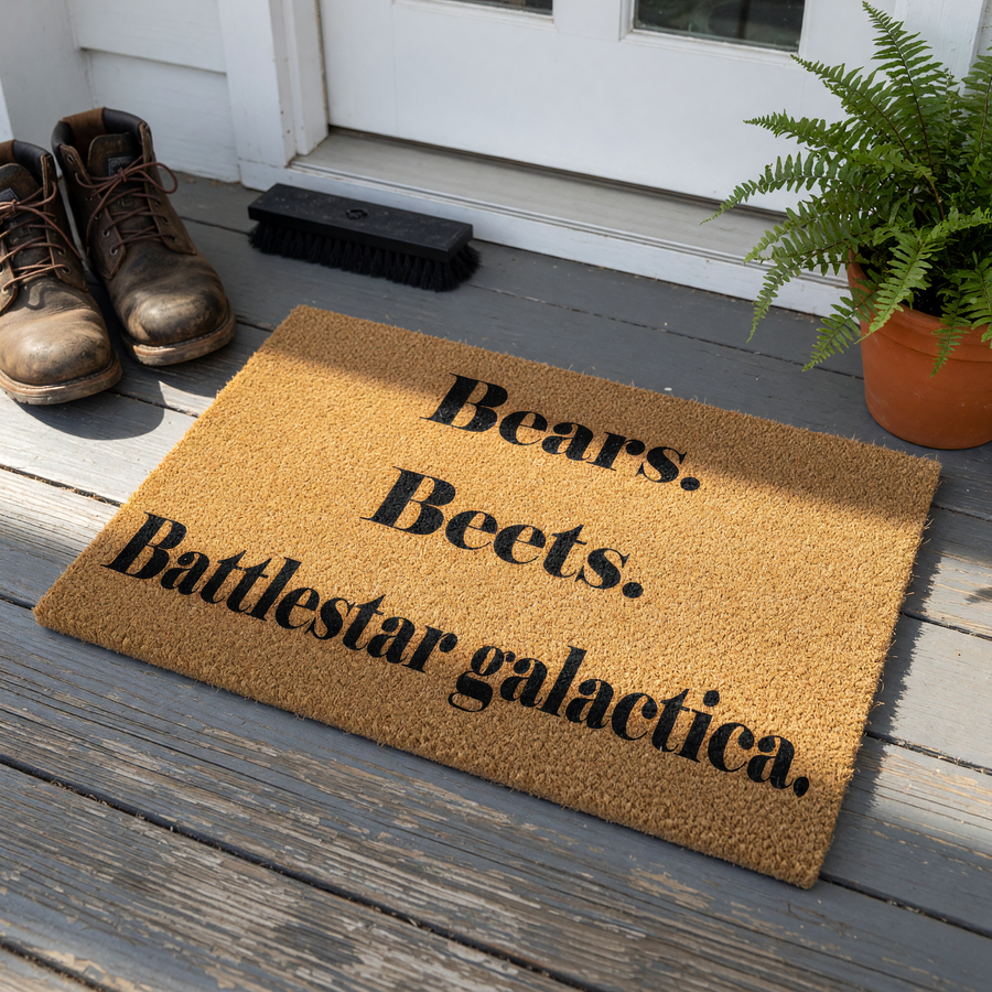 Funny TV show quote doormat featuring the text Bears, Beets, Battlestar Galactica printed on a natural coir fiber welcome mat, perfect for a front porch entry or home decor for fans of classic comedy television series and pop