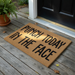 Punch Today In The Face coir doormat featuring bold black typography centered on a natural brown coconut fiber mat, providing a humorous and motivational welcome for your front porch or entryway decor on a clean white background.