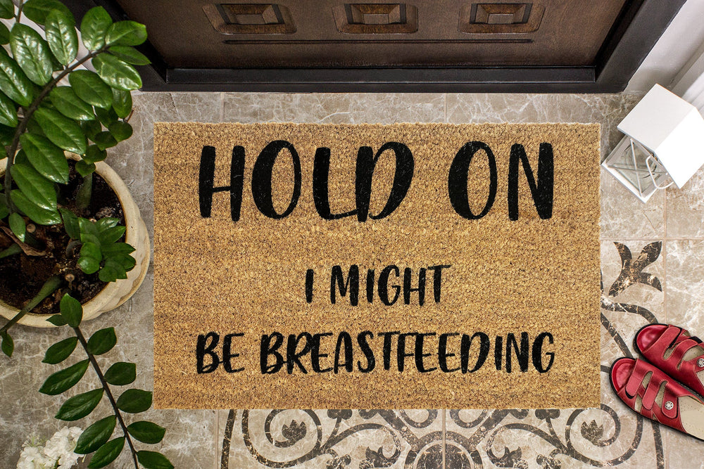 Hold On I Might be Breastfeeding Funny Doormat