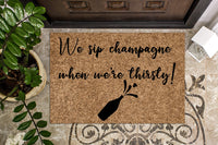 We sip Champagne when we're thirsty Funny Doormat
